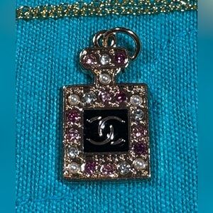 Gold Perfume Bottle Pendant with Pink and White Accents
